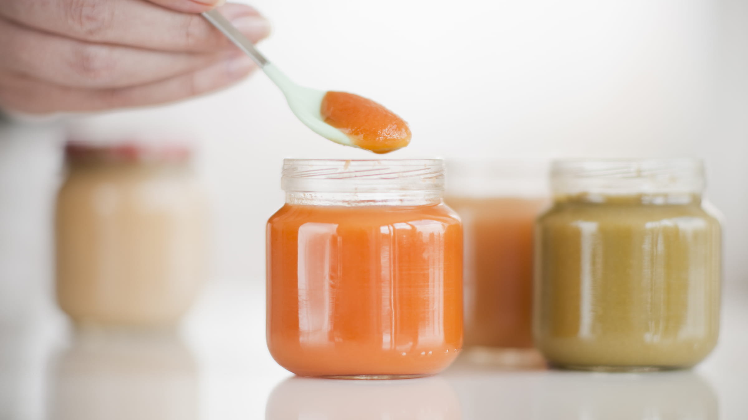 hand-spooning-baby-food