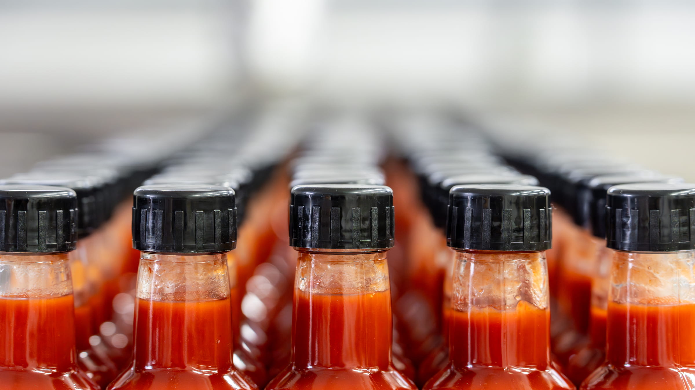 rows-of-red-hot-sauce-bottles