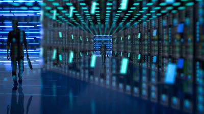 Man walking through server room